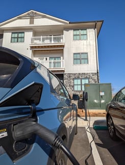 EV Charger in use outside apartment building