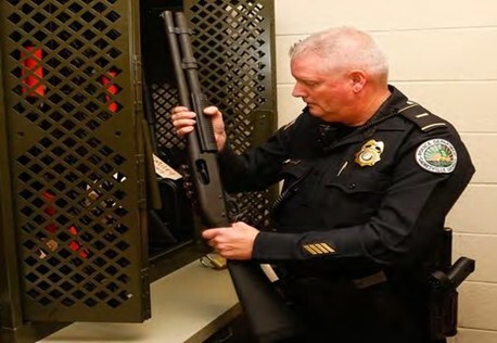officer-checking-in-weapon