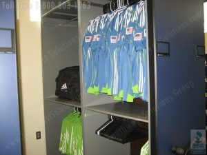 storing uniforms and hanging jerseys in the shelving