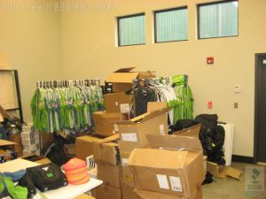an unorganized mess before high density athletic equipment storage shelving was installed